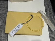 Thacker yellow bangle wristlet clutch bag with tassel - New