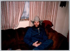 Vtg Color Snapshot Bearded Man In Cowboy Hat & Denim Jacket On Couch 1970s