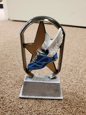 Track trophy or award, running, with engraving, about 5" tall, star background