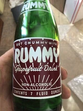 ACL SODA BOTTLE RUMMY GRAPE FRUIT DRINK 1957 GREEN GLASS . 