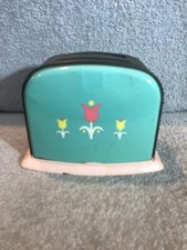 Vintage Ohio Arts Toy Toaster featuring Tulips on a turquoise background