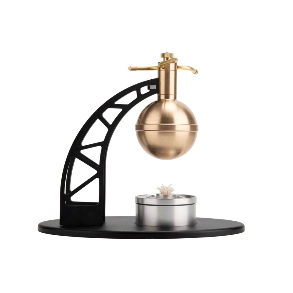 A fully functional miniature steam engine that actually runs on heat — a kinetic desk sculpture that doubles as a conversation-starting physics lesson.