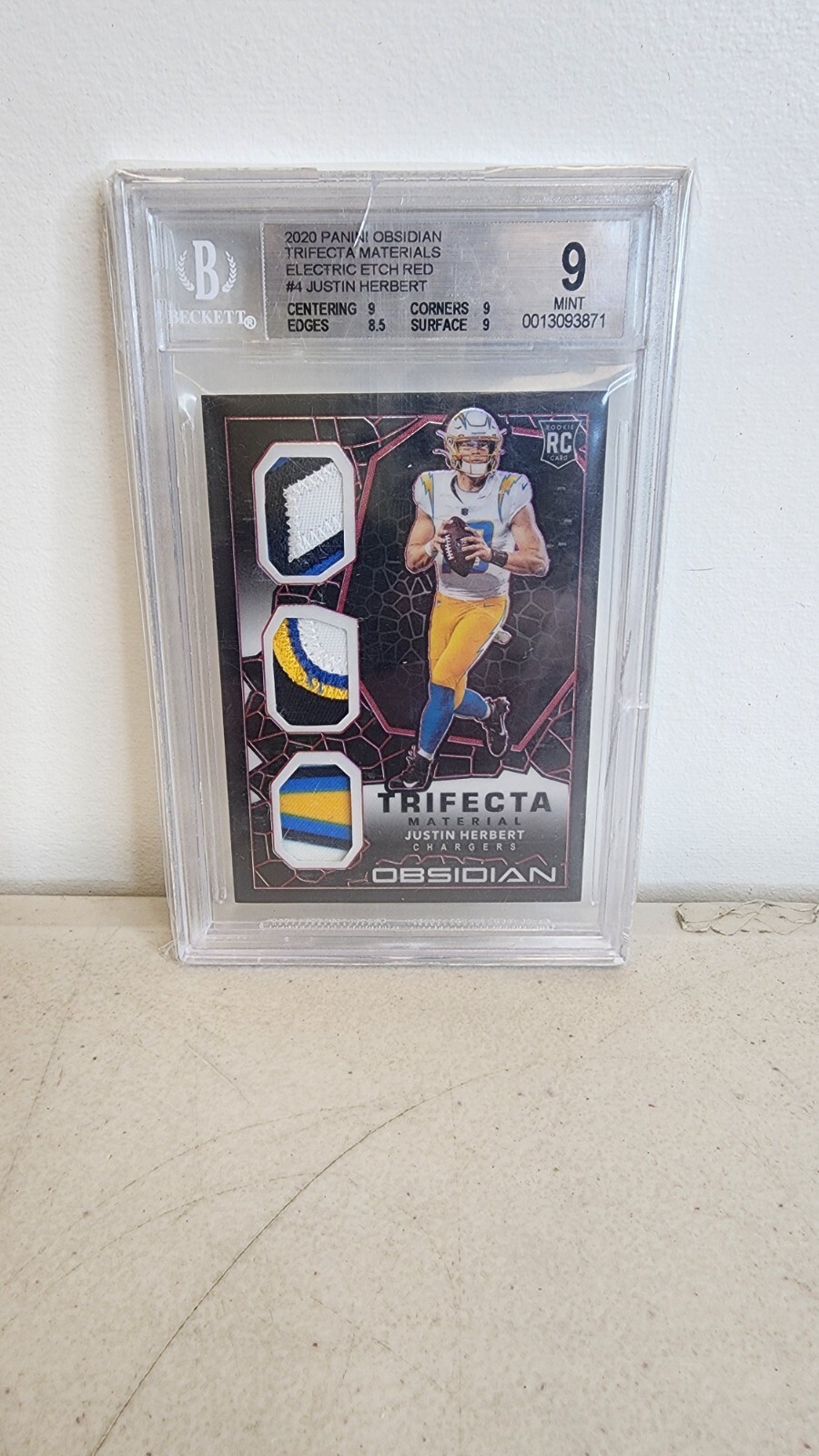Justin Herbert Panini Obsidian Trifecta Material #TM4 Electric Etch-Red