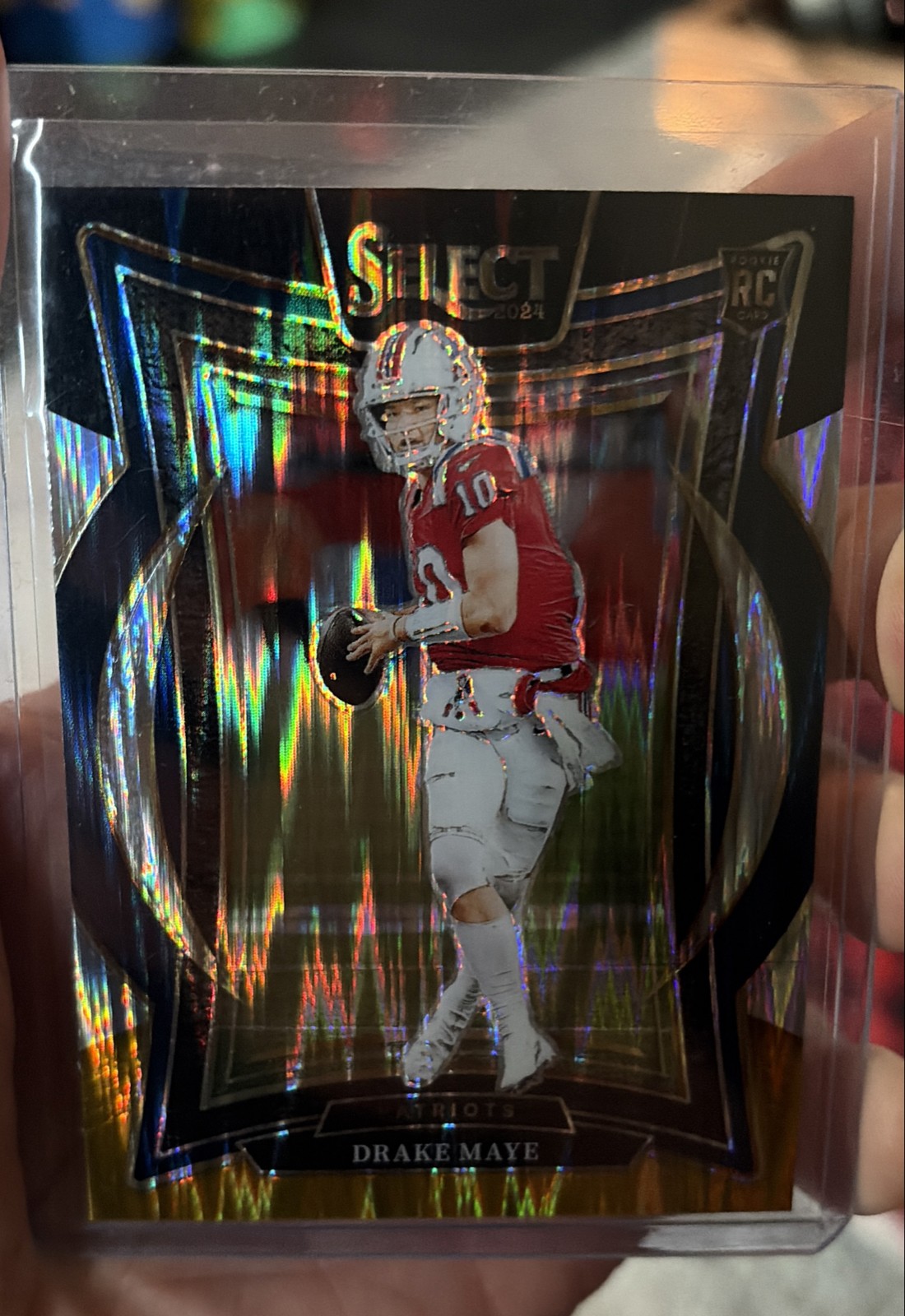 2024 Panini Select - Concourse Drake Maye #27 Black & Orange Shock Prizm (RC)