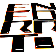 PARA NISSAN FRONTIER 2022 - 24 NEGRO NARANJA EXTERIOR 3D ELEVADO ABOVEDADO DELANTERO LETRAS GRL