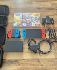 Nintendo Switch OLED 64GB rot/blau Bundle Dock Joy-Con Grip 3 Spiele