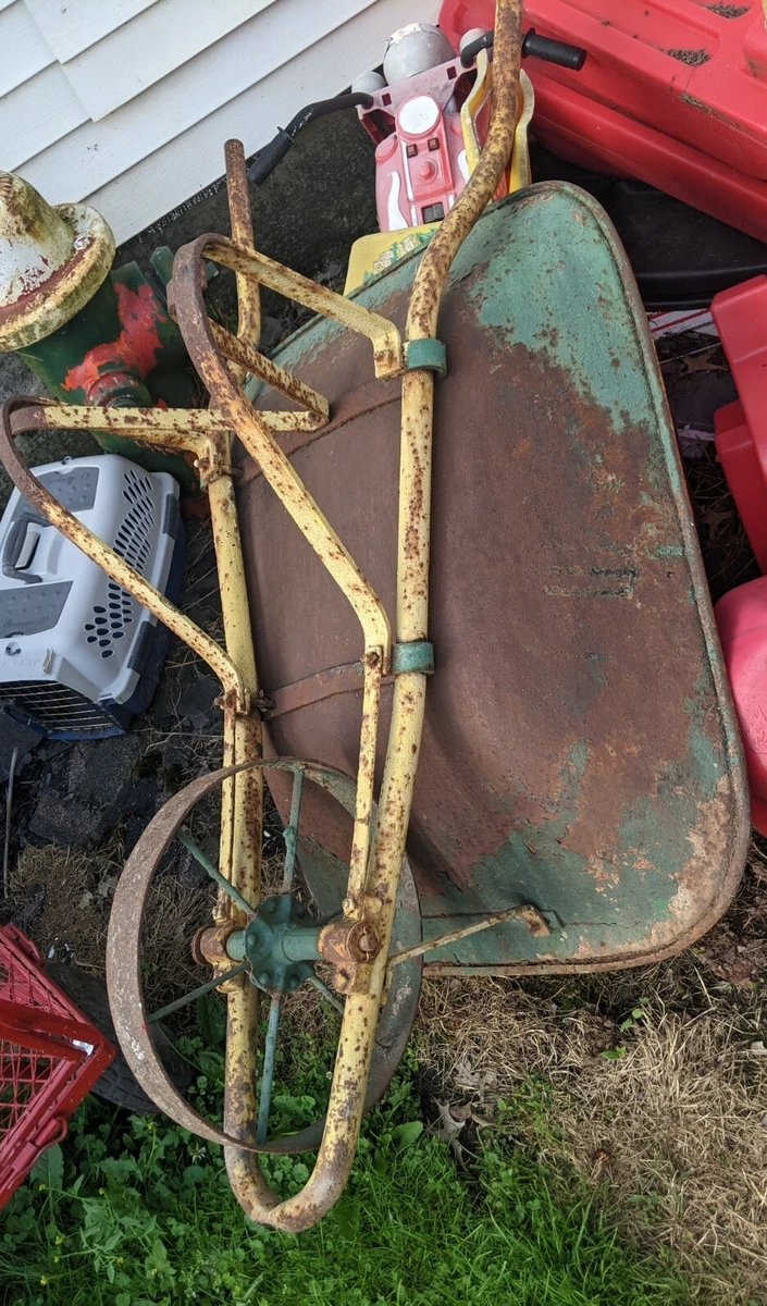 Antique wheelbarrow with metal wheel deals