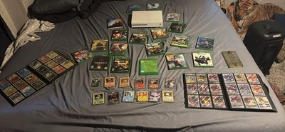 Expensive pokémon cards and full xbox setup cords included with games. TCG app