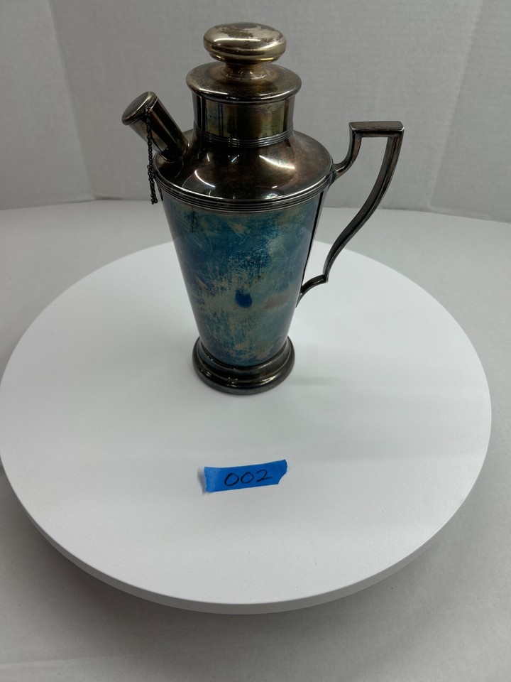 A genuine Art Deco Meriden silverplate cocktail shaker — the kind of elegant, era-defining barware that makes a home bar look like a speakeasy.