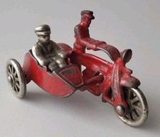 HUBLEY CAST IRON MOTORCYCLE COP W/ POLICE SIDECAR AND PASSENGER RED NICKEL WHEEL