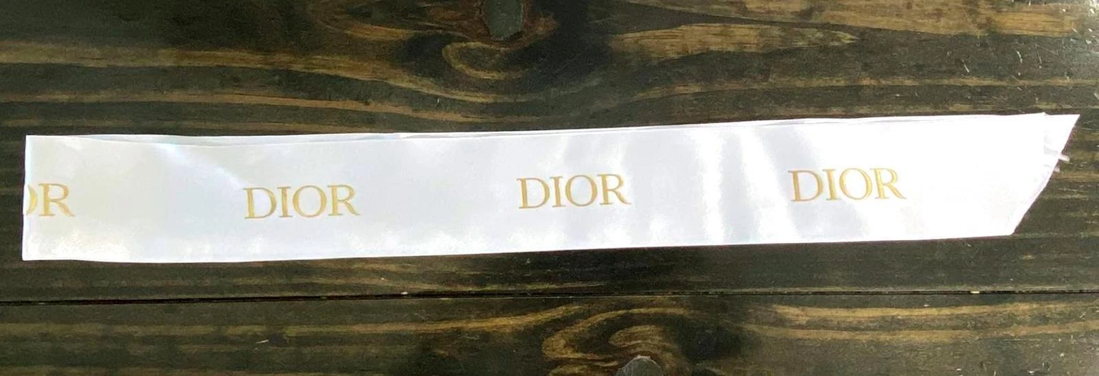 Ensemble sac à poussière ruban satin et boucle d'oreille marque Dior