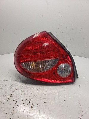 Used Left Tail Light Assembly fits: 2000 Nissan Maxima quarter panel mounted L.