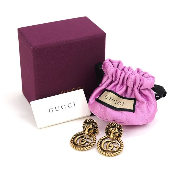 Boucles d'oreilles GUCCI double G tête de lion vieilli finition or métal accessoires femme