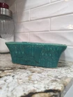 vintage McCoy rectangular planter in a turquoise drip glaze with Butterfly