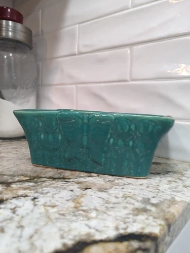 vintage McCoy rectangular planter in a turquoise drip glaze with Butterfly