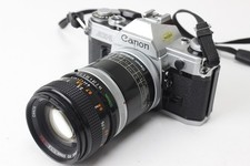 Canon AE-1 35mm SLR Film Camera with 2 Lenses, Extension Tube and some Paperwork