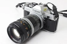 Canon AE-1 35mm SLR Film Camera with 2 Lenses, Extension Tube and some Paperwork