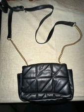 Black Crossbody Bag With Gold And Black Staps From Primark