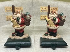 2 Vintage Cast Iron Santa Claus Stocking Holders Adjustable Hooks Continents