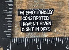 EMOTIONALLY CONSTIPATED Funny Saying Humor Lapel Hat Pin Badge Metal