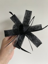 Gorgeous black fascinator with sinamay loops and feathers on a clip
