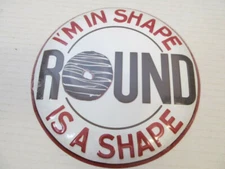 Open Road Brands "I'm in Shape, Round is Shape" Wall Hanging Embossed Metal Sign