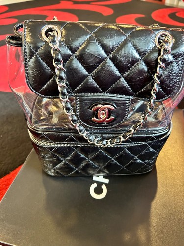 This bag is the Chanel Aquarium Backpack. In black / pvc