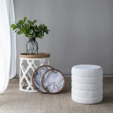 It includes an artificial plant, a vase, a tray, a stool and a side table