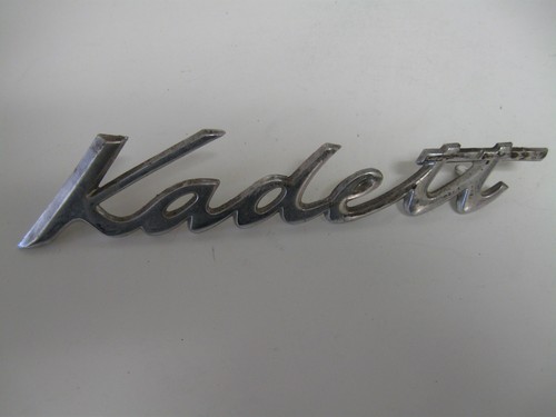   OPEL" KADETT"   EMBLEM BADGE SCRIPT W PINS  USED #2885333