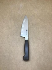 ZWILLING J.A. Henckels Four Star 7" Hollow Edge Rocking Santoku Knife