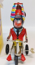 Vintage tin toy monkey on tricycle. not working for display or repair only.
