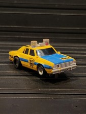 Aurora AFX CHEVY CAPRICE POLICE CAR HY-71 YELLOW/BLUE