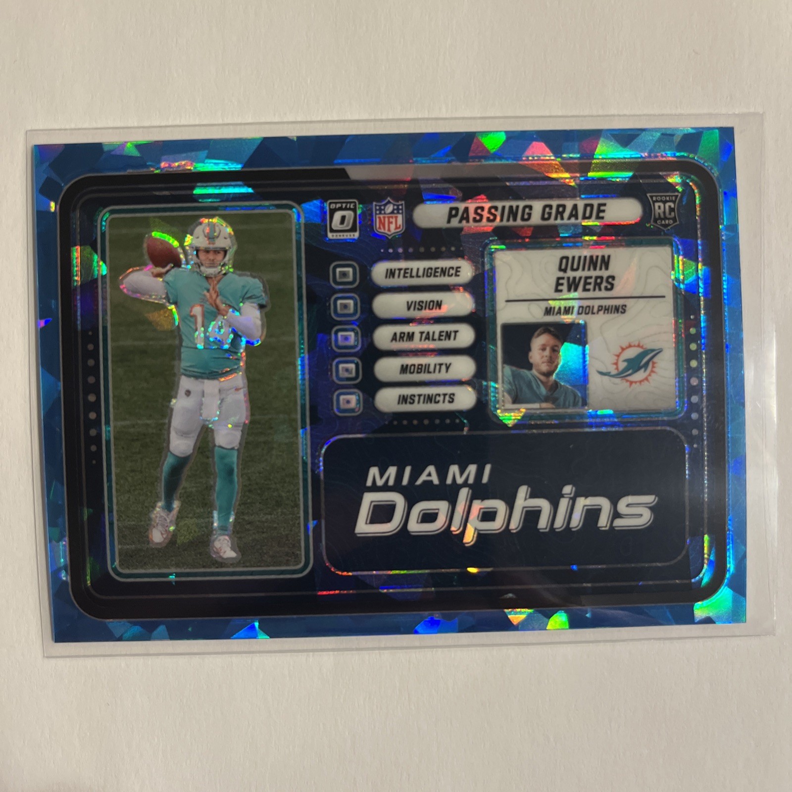 2025 Optic Quinn Ewers Passing Grade Blue Ice RC /55 Dolphins