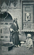 Egyptian veiled ethnic woman chestnuts seller Cairo