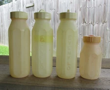Lot of 4 Vintage Evenflo Plastic Baby Bottles with lids
