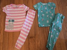 Girls size 2T, two sets of pajamas from Carters