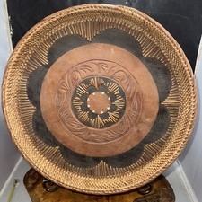 Gorgeous hand-woven rattan serving tray with a Carved Wooden Base. Y