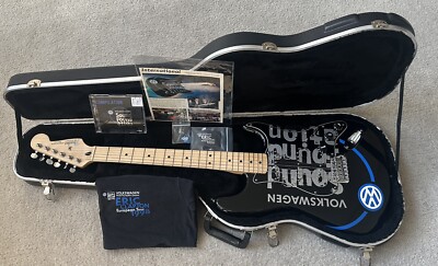 World Star Eric Clapton Signs a Piece of his Guitar