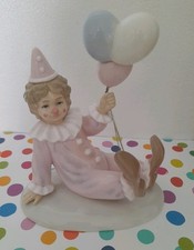 The Leonardo Collection Porcelain Figurine Of A Clown Holding Baloons. Pink