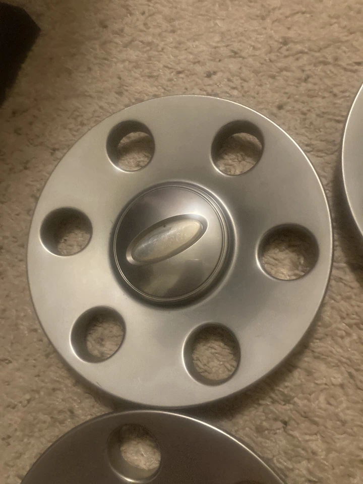 Juego tapacubos central satinado platino Ford F-150 Expedition 2007-2011 7L14-1A096-EB Foto 4 de 4