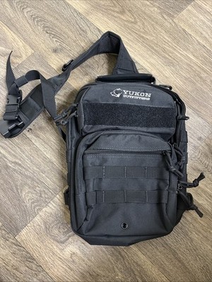 YUKON OUTFITTERS Men's Black Sling Bag Hiking Scouting Multiple Pockets Backpack