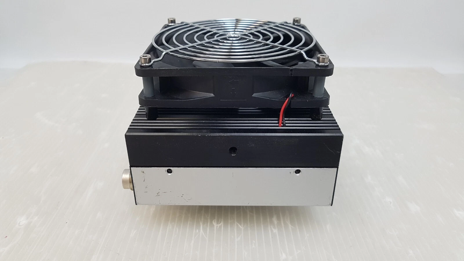 Side of the Electra camera head with finned heat sink and fan