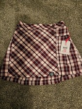 Justice Plaid Skort. Burgundy and white pleated skort with shorts under. Size M