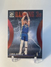 2023-24 Panini Donruss Optic - Raining 3s Luka Dončić #15 Red Prizm /99