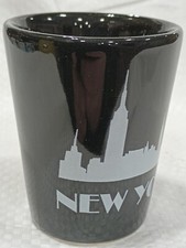 white new York City skyline on a black ceramic shot glass