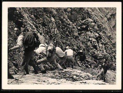 Photography of mountaineers, a rope team working their way up a slope
