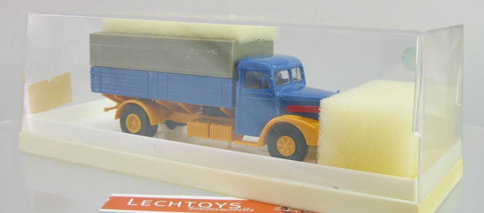 Brekina 1:87 H0, Nr. 7200,  MAN Pritschen LKW mit Plane blau orange, OVP - Bild 1 von 1