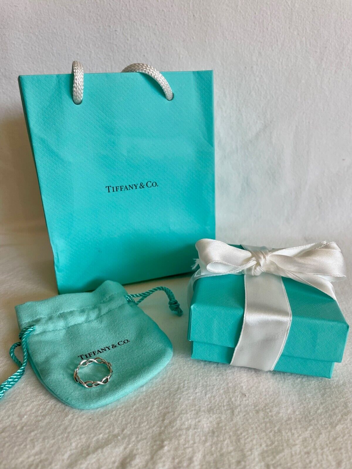 Tiffany & Co Infinity Ring size 5.5 with bag, box… - image 1