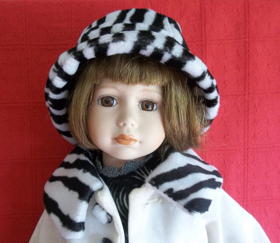 Porcelain Doll 'Dog Walker Dressed in Cream Coat and Black & Cream Hat