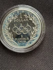 1988 S Proof Olympic Commemorative 90% Silver Dollar in original acrylic capsule
